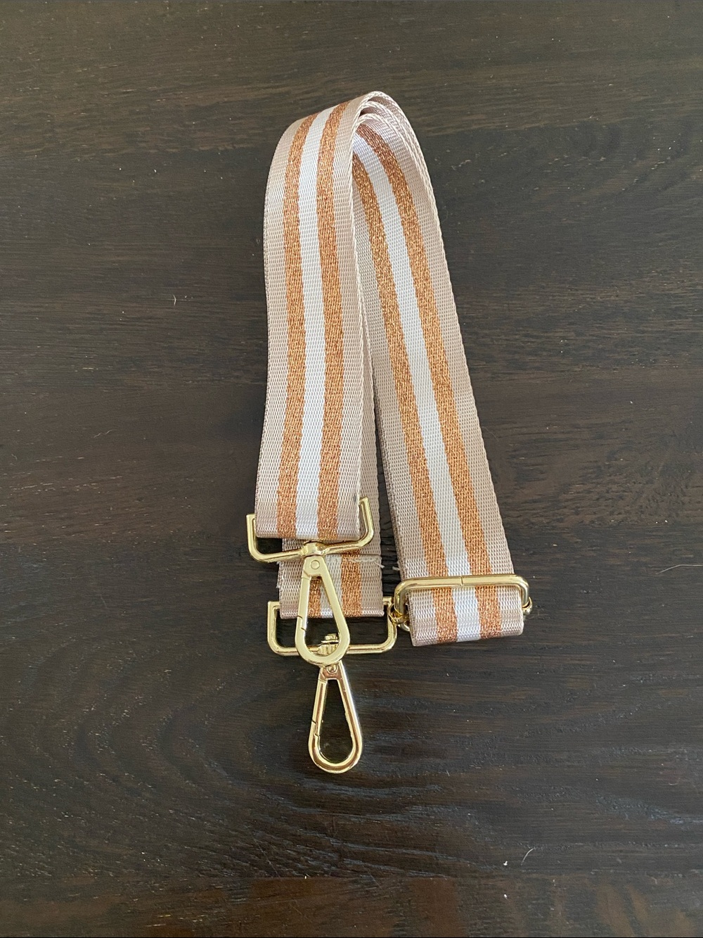 Gold and Tan crossbody bag strap.